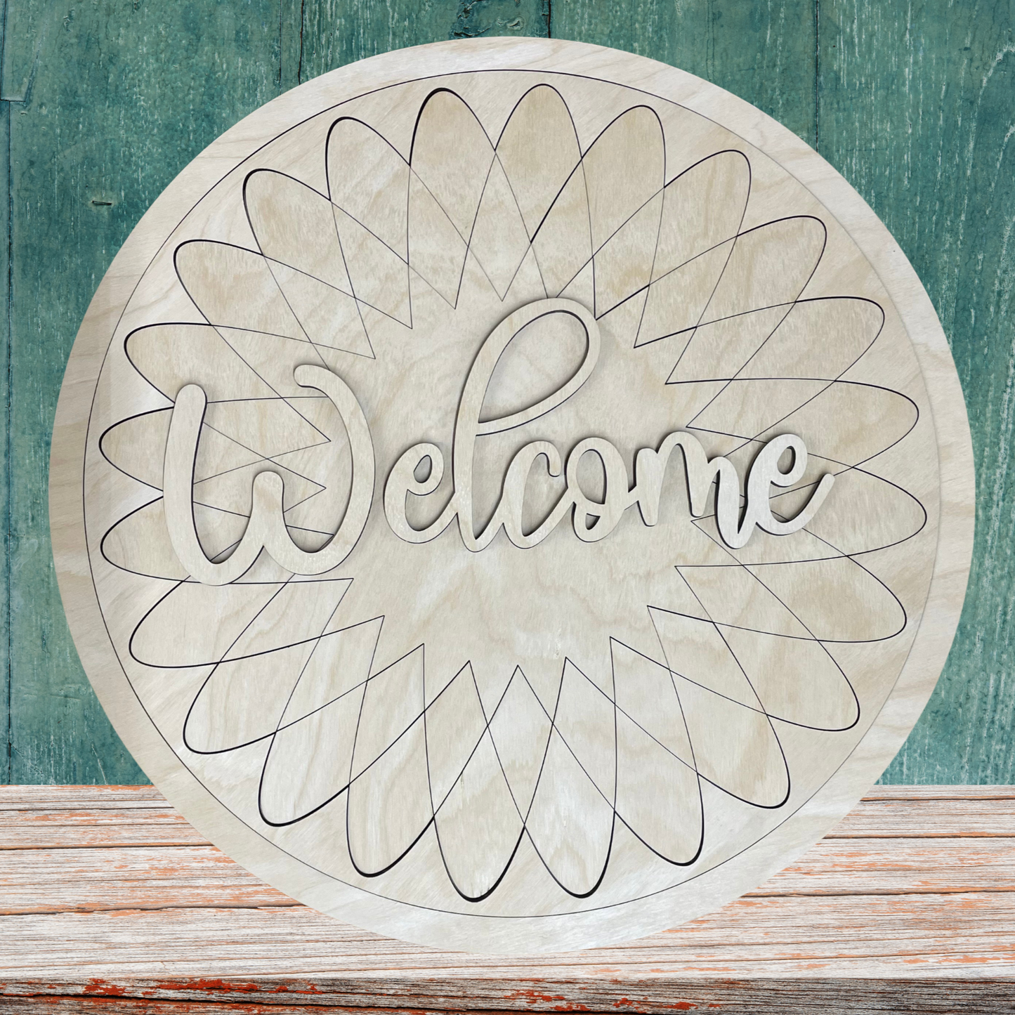 Decorative round sign with 'Welcome' text on a wooden surface