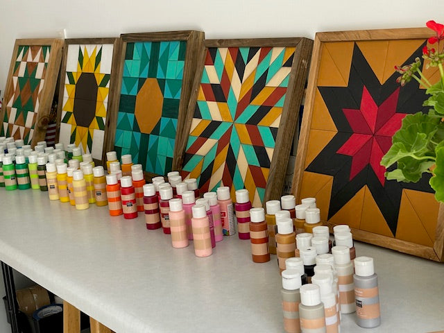 Signs and paint set up for a paint party